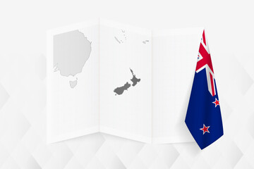 A grayscale map of New Zealand with a hanging New Zealand flag on one side. Vector map for many types of news.