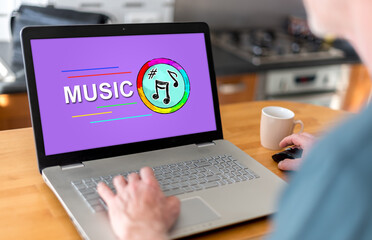 Fototapeta na wymiar Online music concept on a laptop