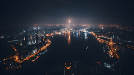 A panoramic drone shot of a city skyline at night, capturing the beauty of the glowing lights and the reflective river below