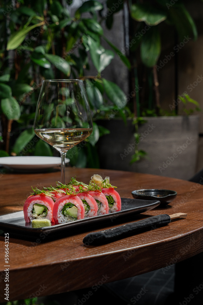 Sticker sushi roll with avocado wrapped in tuna