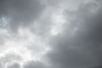 Fototapeta premium Dramatic background caused by dark clouds in the sky. Forecast of rain, thunderstorm, bad weather. The beauty of nature. Abstract background image.