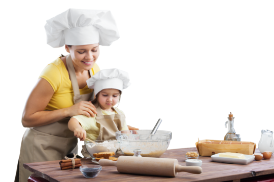 Happy mother and child daughter preparing food