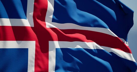 Close-up of the national flag of Iceland flutters in the wind on a sunny day , 4k slow motion