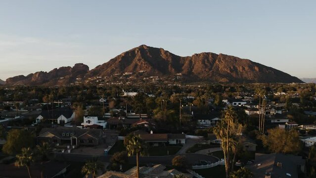 Aerial view of residential homes beneath Camelback Mountain in Arizona.