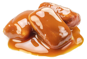 Caramel candies covered with melt caramel isolated on white background.