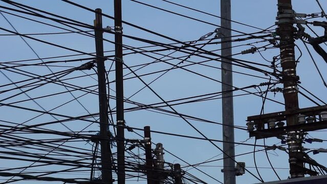 Electric cable network with a sky background
