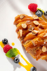 French croissant with caramel and hazelnut on top
