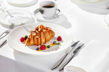 French croissant with caramel and hazelnut on top