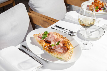 Calzone with mozzarella and ham