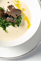 Mushroom cream soup with truffle and herbs