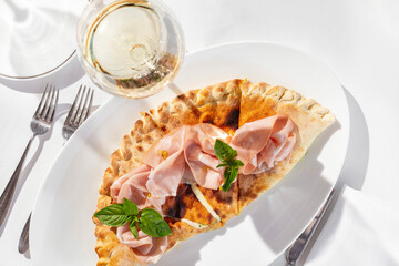 Calzone with mozzarella and ham