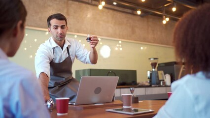 Group of barista or bartender students having a workshop how to brew and test coffee with professional - expert barista.