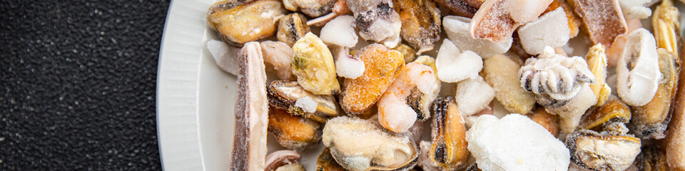 seafood cocktail frozen food mussels, rapan, octopus, scallop, squid healthy meal food snack on the...