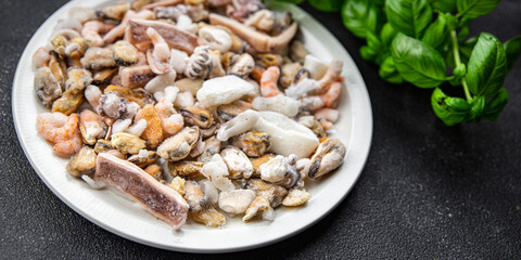 seafood cocktail frozen food mussels, rapan, octopus, scallop, squid healthy meal food snack on the...