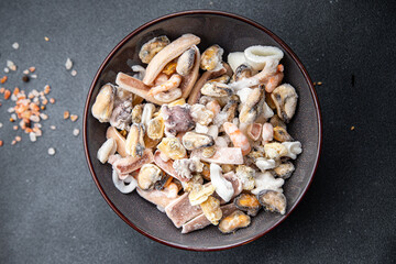 seafood cocktail frozen food mussels, rapan, octopus, scallop, squid healthy meal food snack on the table copy space food background rustic top view 