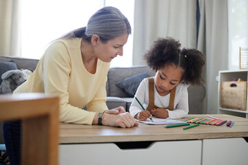 Taking the time to get to know her. Shot of a little girl drawing in a psychologists office.