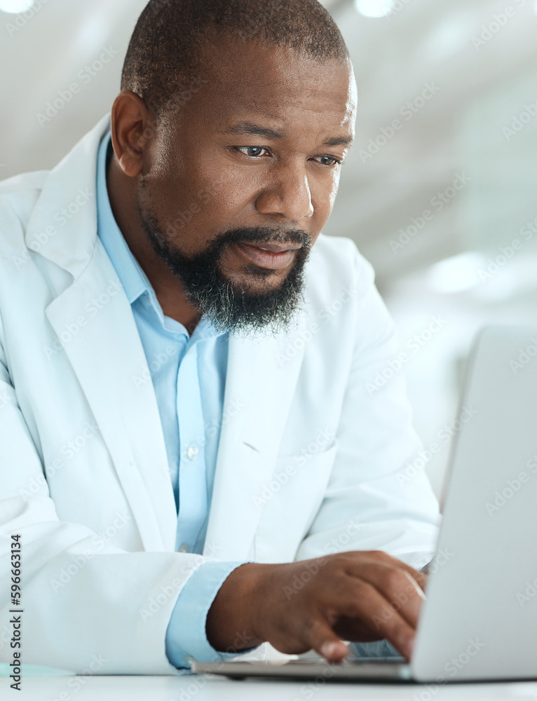 Poster where are the reports. shot of a handsome mature scientist sitting alone in his laboratory and using