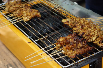 Mushroom satay on grilled process. Sate is one of indonesian famous food