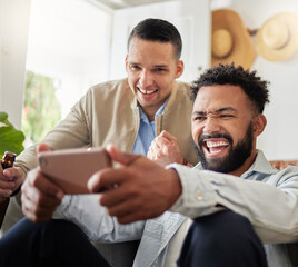 Check out this cool new app. Shot of two men laughing while looking at something on a cellphone.