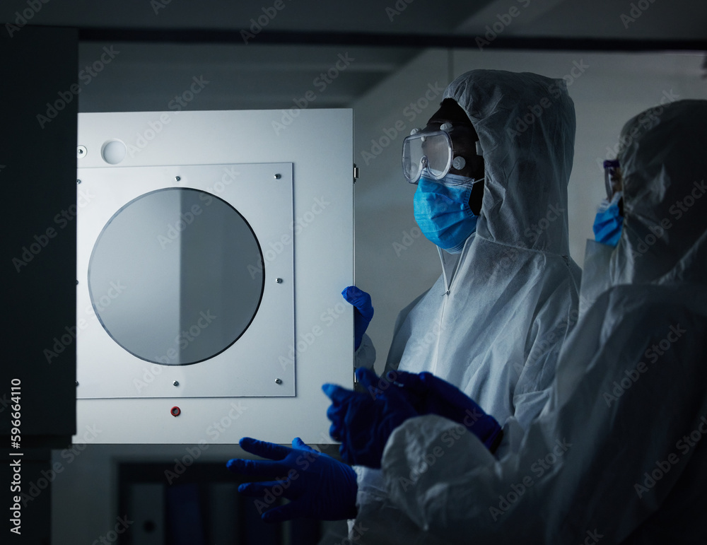 Poster Keeping everything safe. Shot of two scientists working at a lab.
