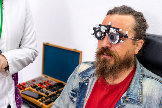 Beyond the Horizon: Redhead Optometrist Conducting Eye Examination on Viking-Looking Middle-aged Patient