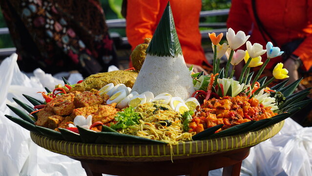Nasi tumpeng (cone rice) served with urap-urap (Indonesian salad), fried chicken and noodles. Nasi tumpeng usually served at birthday parties or thanksgiving