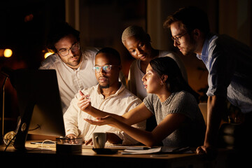Finding ways to get to the results they want. Shot of a group of businesspeople working together on...