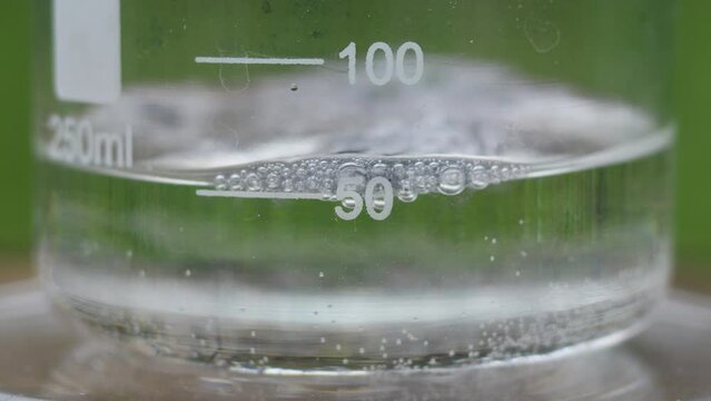 The chemical process of dissolution magnesium metal in sulfuric acid.  During the reaction, the indicator dye methyl orange is added, the reaction mixture turns red, which indicates an excess of acid.