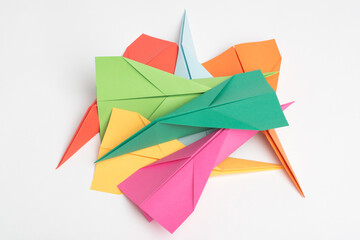 Pick a plane and lets play. Studio shot of a pile of colourful paper jets.