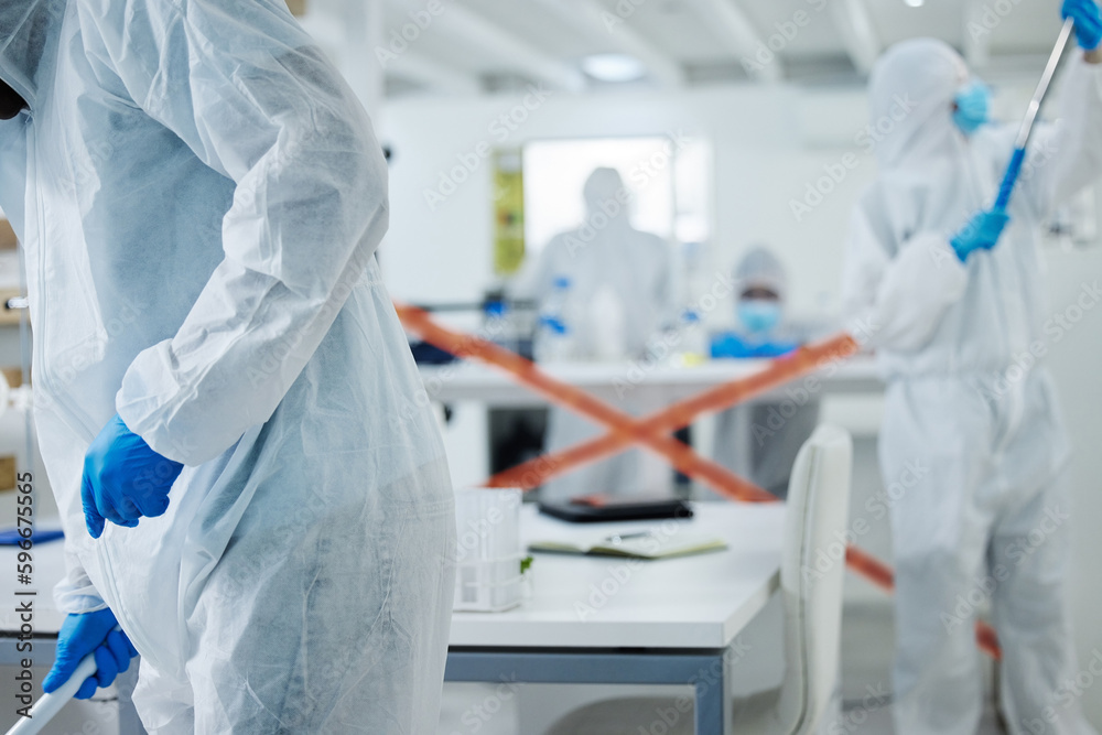 Poster Its off limits. Shot of a group of scientists cleaning up a mess at a lab.