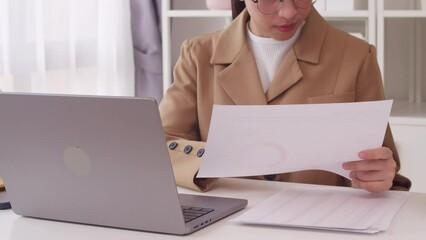 Female financial advisor making retirement saving details plan for her client in the modern office.