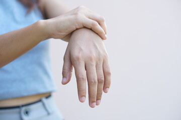 Asian woman having hand numbness