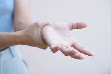 Asian woman having hand numbness