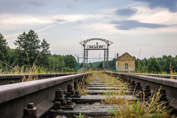 Gate with Russian word Peace on old railroad border crossing between Poland and Belarus near...
