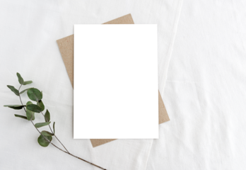 A mock-up of a stationery scene in a light key. Empty vertical greeting card with transparent PNG background and dry grass on white linen background.