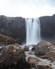 Drone Aerial of Kerlingarfoss Waterfall near Olafsvik on Iceland's Snafellsnes peninsula. High quality photo. Beautiful waterfall with the Snaefellsjokull Volcano in the background.