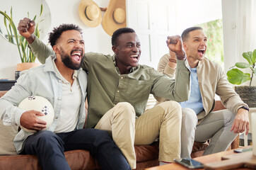 We never miss a game. Shot of three male friends watching something together while sitting on a...
