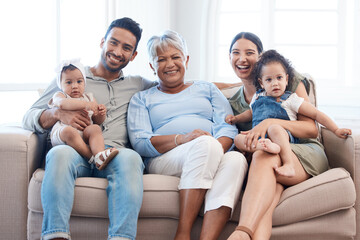 A good family always has space for more. Shot of a family spending time together on a sofa at home.