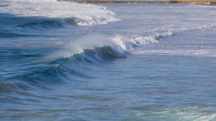 Line of wave on the beach shore.