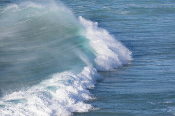 Beautiful breaking wave on the beach.