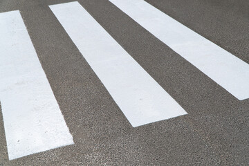The crosswalk - zebra crossing. Crosswalks symbolize pedestrian safety