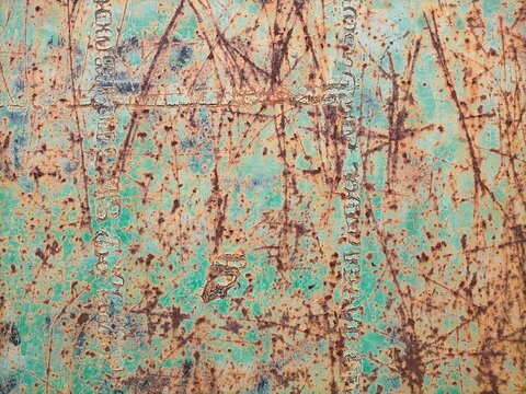 metal surface with old green color full of scratches with rust