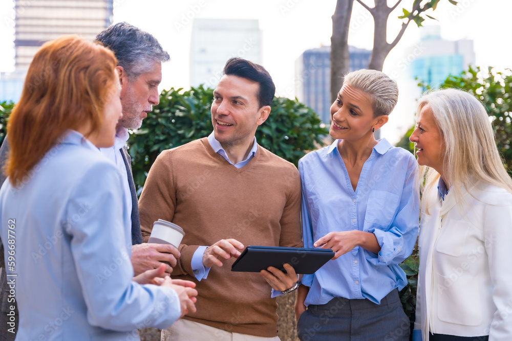 Wall mural cheerful portrait of a happy group of co-workers laughing and having fun outdoors a corporate office