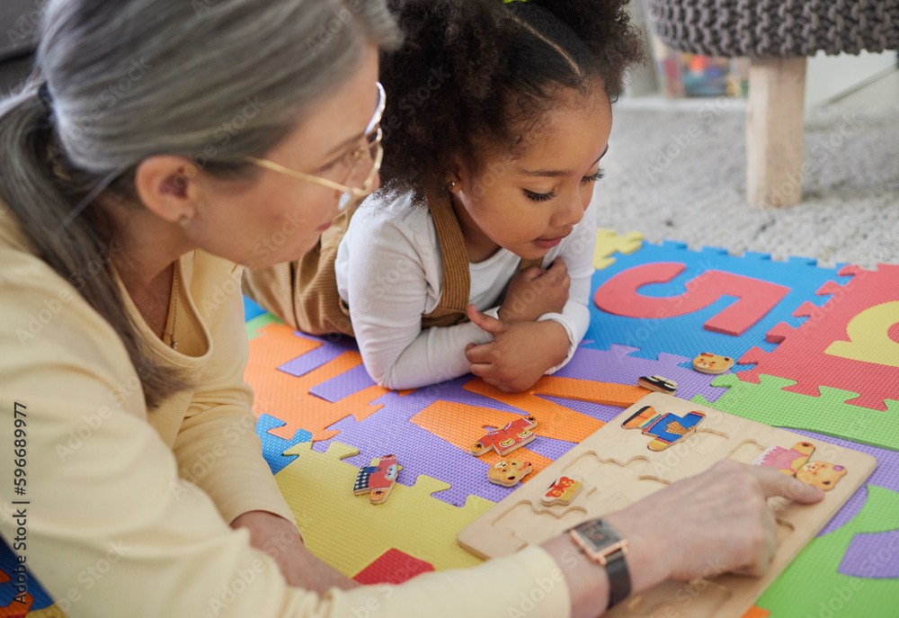 Canvas Prints Exploring the young mind with play. Shot of a little girl playing with toys in her therapists office.