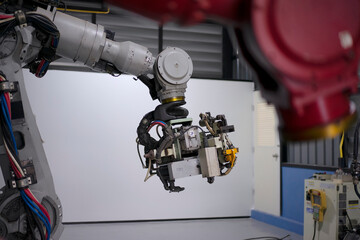 Engineer work at robotic arm factory.