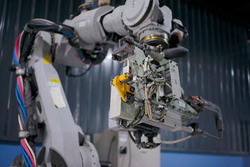 Engineer work at robotic arm factory.