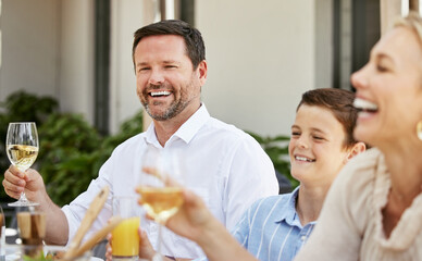 Enjoying mealtime with family. Shot of a family enjoying a meal together.