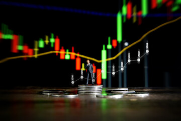 Business concept. Businessman standing on a pile of silver coins.