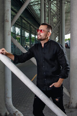 elegant guy in pink glasses