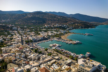 Naklejka premium Aerial view of the harbour in the holiday town of Elounda on the Greek island of Crete